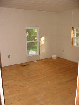 Upstairs_back_bedroom_with_drywall_and_sanded_floors