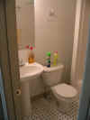 Blair St downstairs new bathroom with cleaning products.JPG (69862 bytes)